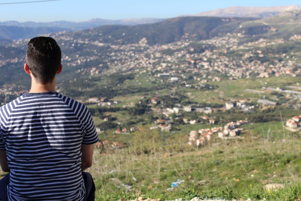 Missionary overlooking a landscape and village in Lebanon